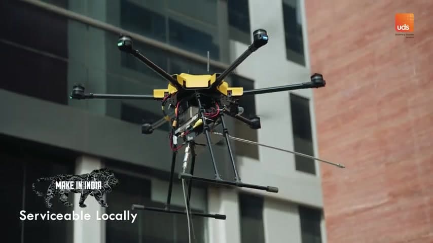 Drone flying near building